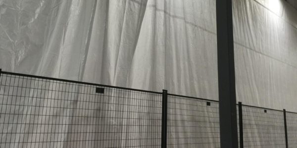 Hoarding wall separating construction from food production at Weston Bakeries in Brampton, Ontario